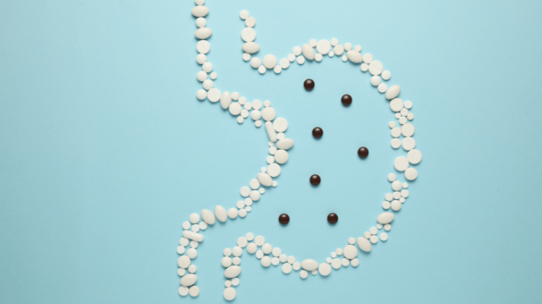 Контури шлунка, викладені таблетками, символізують лікування та підтримку здоров’я травної системи"