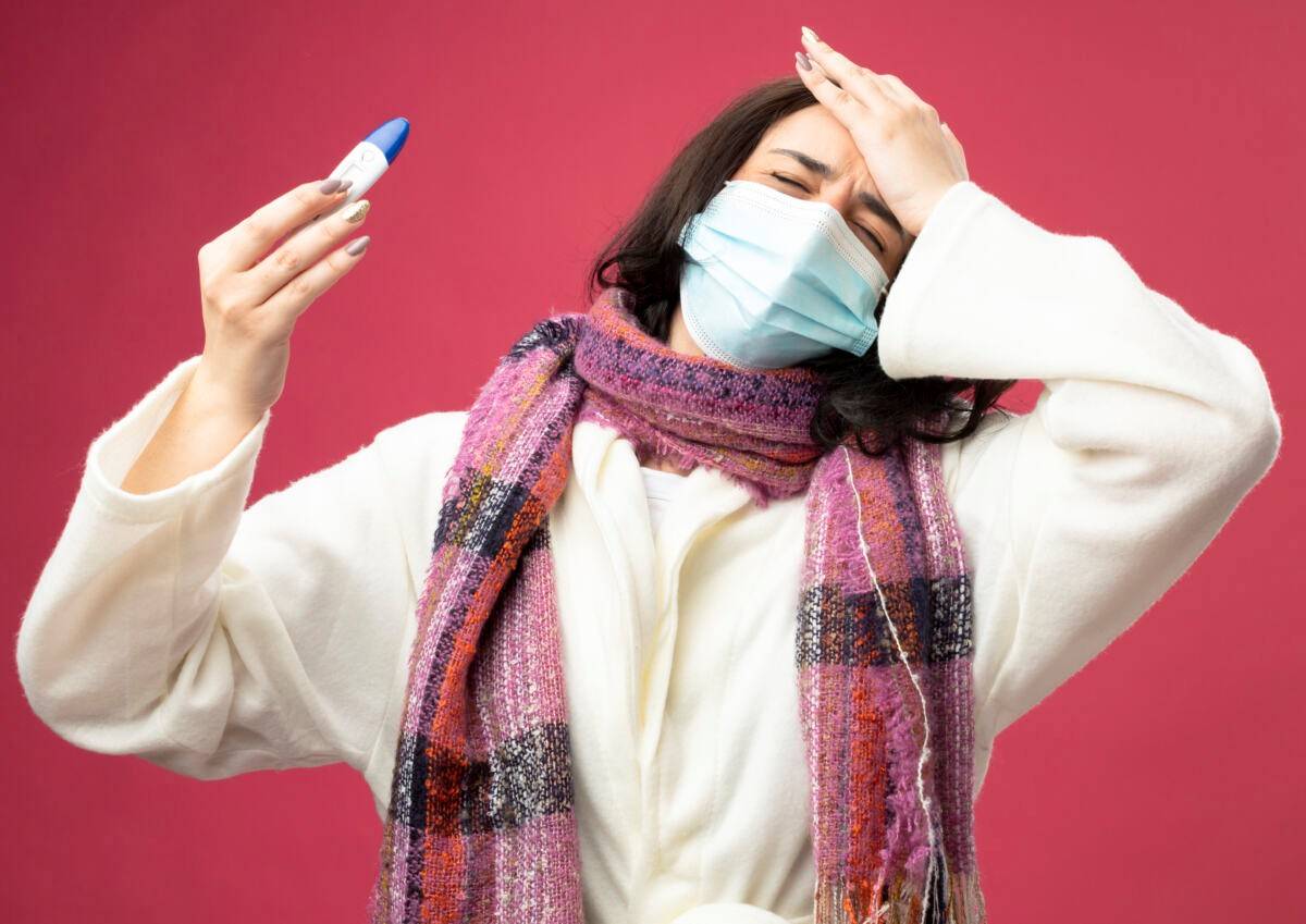 Симптоми грипу – висока температура, слабкість та головний біль.